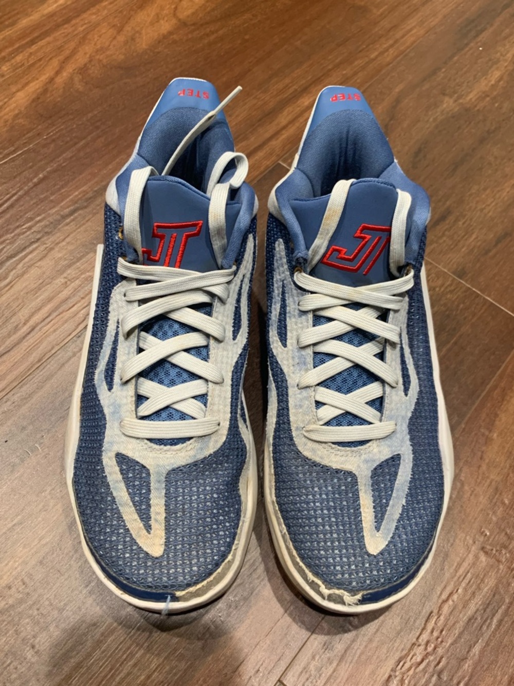 Light Blue and White Jordan’s with Gold Tongue and Red Logo